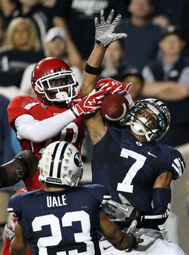Utah wide receiver DeVonte Christopher (10) is unable to come up with a 14-yard pass by Jordan Wynn in the end zone, as BYU cornerback Preston Hadley (7) and safety Travis Uale (23) defend. (AP Photo/Colin E Braley)