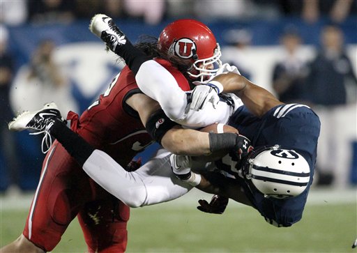 Utah LB Matt Martinez tackles BYU receiver Ross 
Apo during the Utes 54-10 win in Provo (AP 
Photo)