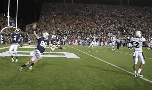 BYU TE Marcus Mathews celebrates after catching
the game-winning touchdown against Utah State
(Deseret News)