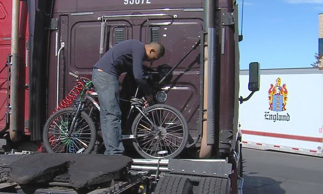 C.R. England Global Transportation driver Jose 
Gomez stores a bicycle on the back of his cab 
and rides it when he stops for a break.