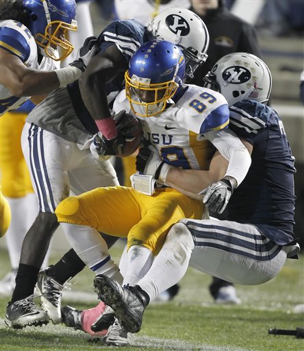 San Jose State's Chandler Jones is tackled by BYU's Jordan Pendleton, right, and Corby Eason. (AP Photo/George Frey)