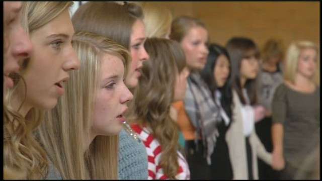 Students in the choir sang Monday morning in
honor of their lost member.