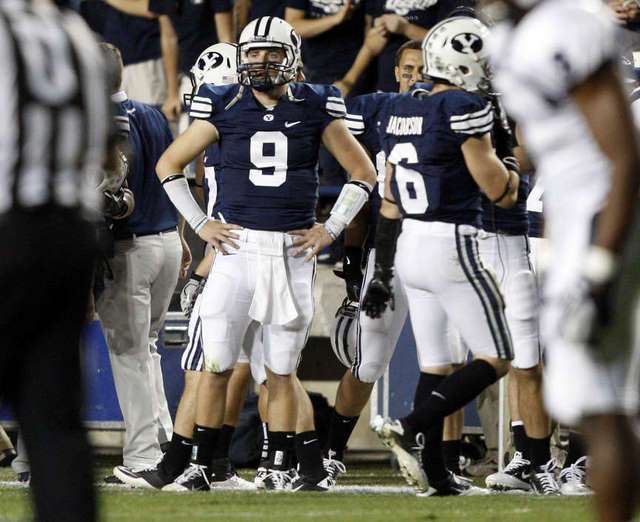 BYU QB Jake Heaps stands on the sidelines
during the Cougars' game versus the Utah State
Aggies. (AP Photo)