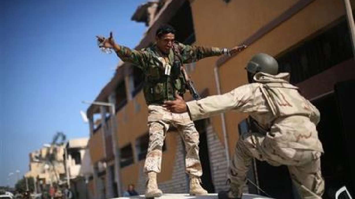 Gadhafi body stashed in shopping center freezer