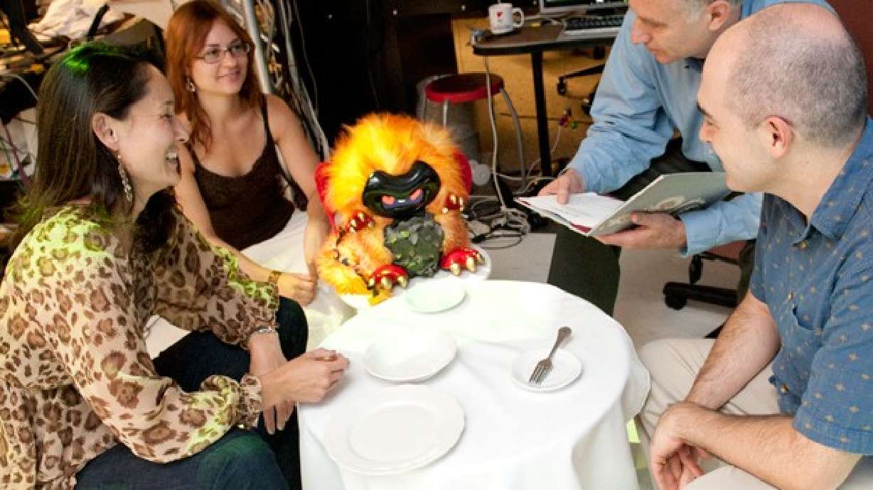 Robot dragon teaches kids language skills, battles impulse to terrorize city