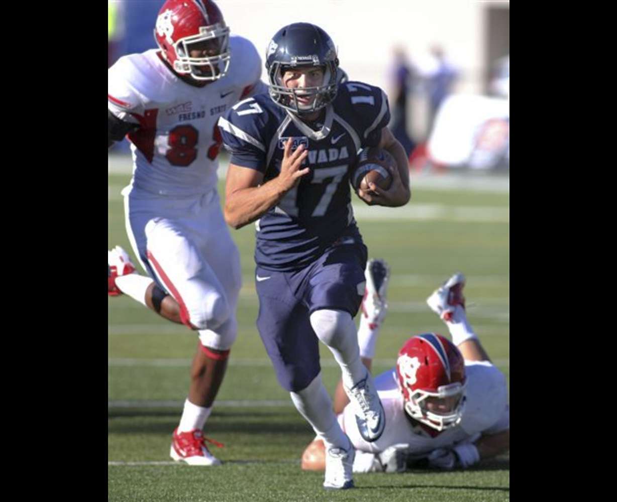 Nevada quarterback Cody Fajardo runs for a
touchdown against Fresno State. (AP
Photo/Cathleen Allison)
