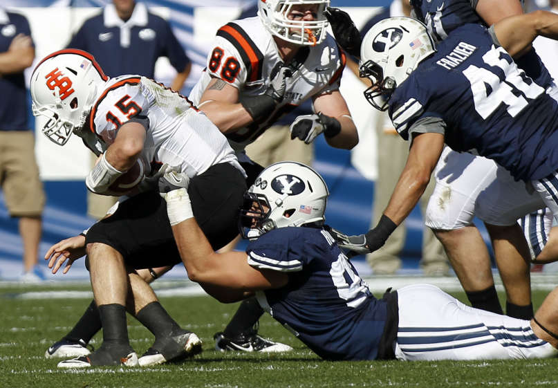 BYU defensive end Graham Rowley takes down
Idaho State Bengals quarterback Kevin Yost.
(Deseret News)