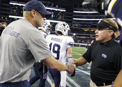 BYU head coach Bronco Mendenhall shakes hands with TCU's Gary Patterson