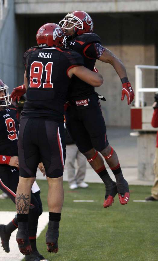 Utah Utes running back John White IV (15) celebrates his touchdown with Utah Utes tight end Kendrick Moeai (81) against Oregon St. during Pac-12 action in Salt Lake City Saturday, Oct. 29, 2011.