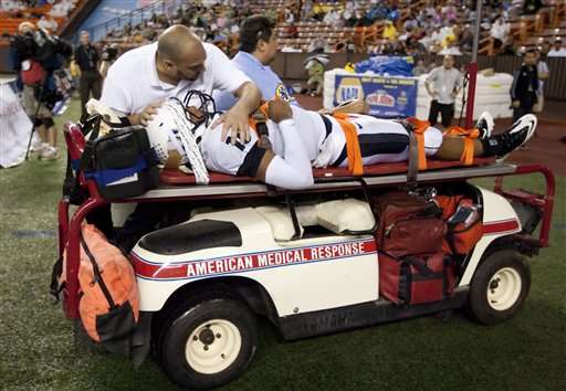 Utah State quarterback Chuckie Keeton is taken
off the field on a medical cart after taking a
hit while playing against Hawaii. (AP
Photo/Eugene Tanner)
