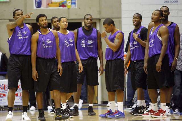 Utah Jazz players and other members of the
purple team stand on the court after a timeout.
(Deseret News)