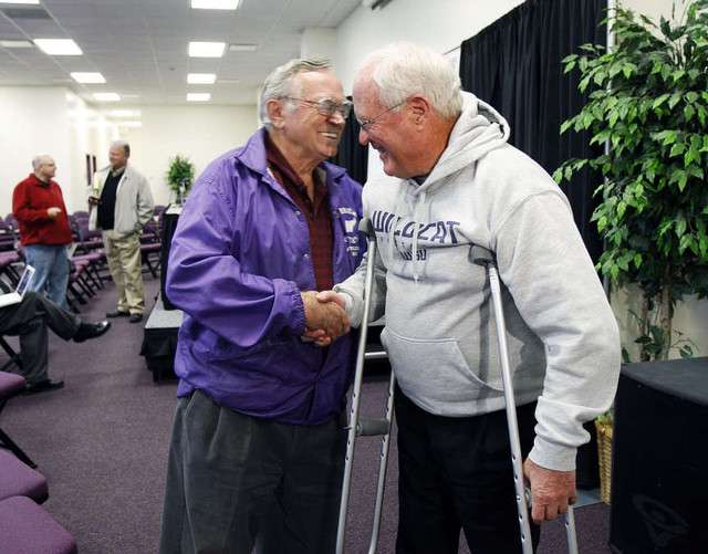 Chick Hislop, left, greets Ron McBride after McBride announced his retirement as the Weber State University football coach at a press conference in Ogden, Tuesday, Nov. 8, 2011. (Photo: Ravell Call, Deseret News)