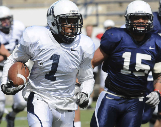 Utah State wide receiver Xavier Martin runs
toward the end zone while being followed by
Reuben Willis (15) during the inner squad
scrimmage at USU Monday. (Jennifer
Meyers/Herald Journal)