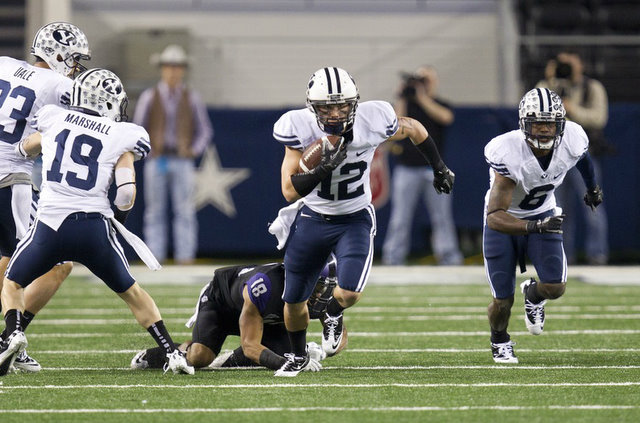 BYU's J.D. Falslev returns a punt for a
touchdown against TCU. (Mark Philbrick/BYU
Photo)