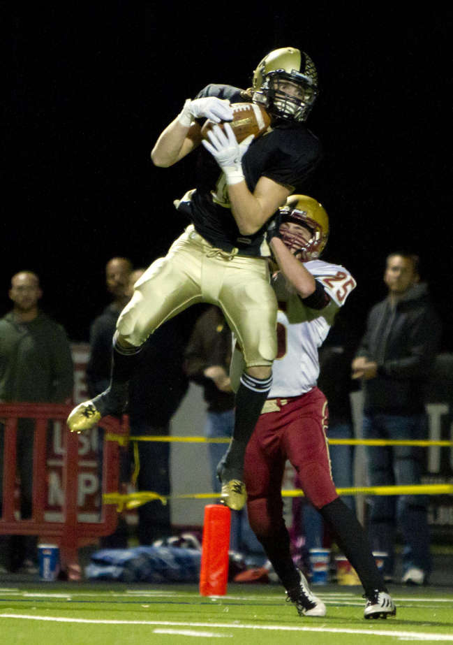 Desert Hills' Ty Rutledge makes a catch from Nate Brinker and runs it in for a touchdown during the Thunder's 23-21 win over Cedar in the 3A semifinals at Hansen Stadium in St. George on Friday, Nov. 11, 2011. (Samantha Clemens /The Spectrum)