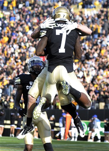 Colorado wide receiver Tony Clemons (7)
celebrates a touchdown with teammates against
Arizona. (AP Photo/Jack Dempsey)