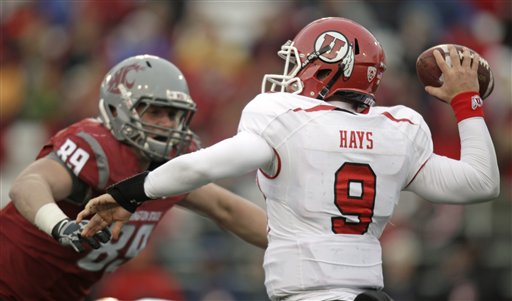 Utah quarterback Jon Hays (9) throws under
pressure from Washington State defensive end
Travis Long. (AP Photo/Dean Hare)