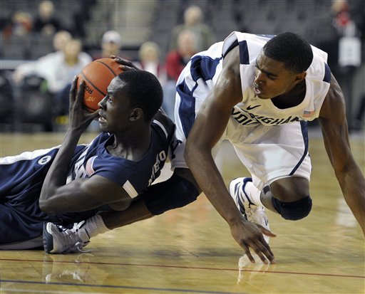 BYU freshman guard Anson Winder battles for the
ball against Nevada (AP Photo).