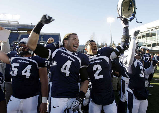 Utah State Aggies safety Walter McClenton (4)
and Utah State Aggies cornerback Cameron
Sanders (2) celebrate. (Deseret News)