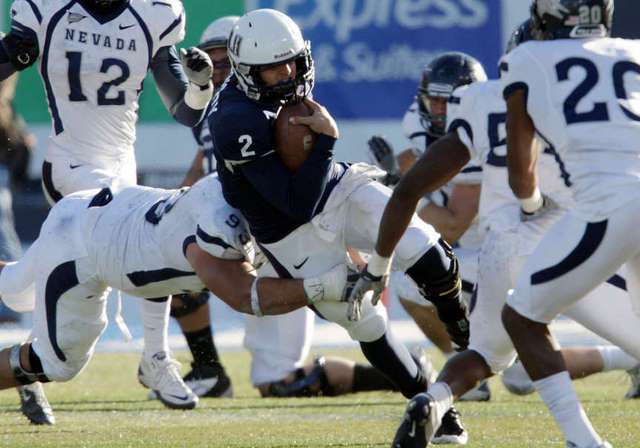 Utah State Aggies quarterback Adam Kennedy (2)
runs against Nevada. USU beat Nevada and is now
bowl eligible. (Deseret News)