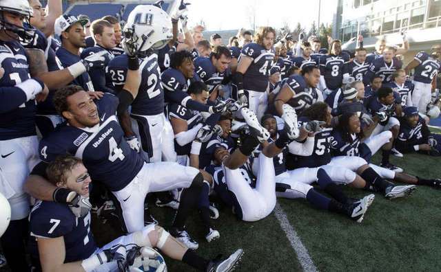 Utah State Aggies celebrate beating Nevada. USU
is now bowl eligible. (Deseret News)