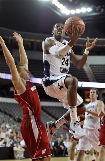 Wisconsin's Ben Brust left, defends as BYU's
Damarcus Harrison (24) drives to the basket.
(AP Photo/Jim Prisching)