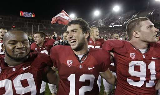 Stanford quarterback Andrew Luck (12)
celebrates with defensive tackle Terrence
Stephens (99) and defensive end Henry
Anderson (91). (AP Photo/Paul Sakuma, file)