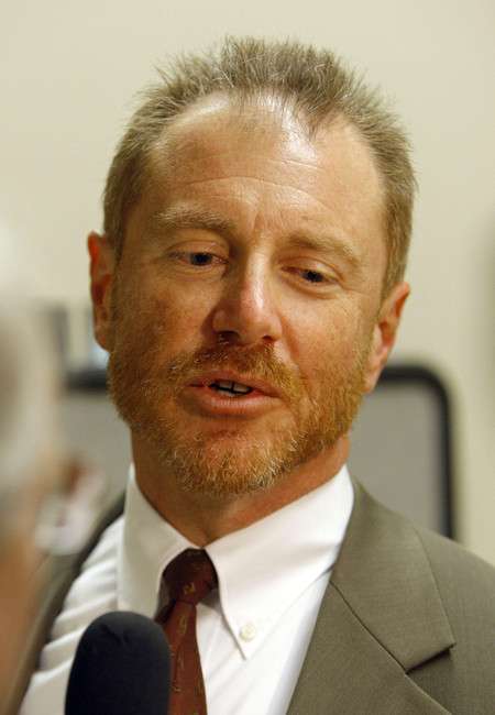 Assistant attorney general Brett DelPorto talks with members of the media after court, Tuesday, Nov. 29, 2011. John Robert Pinder, 53, is seeking a new trial. Pinder was convicted of kidnapping and murder former ranch employees Rex Tanner and June Flood in 1998.