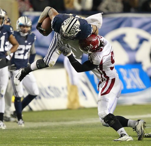BYU's Michael Alisa, left, is hit in midair by
New Mexico State's Stephen Meredith. BYU beat
New Mexico State 42-7. (AP Photo/George Frey)