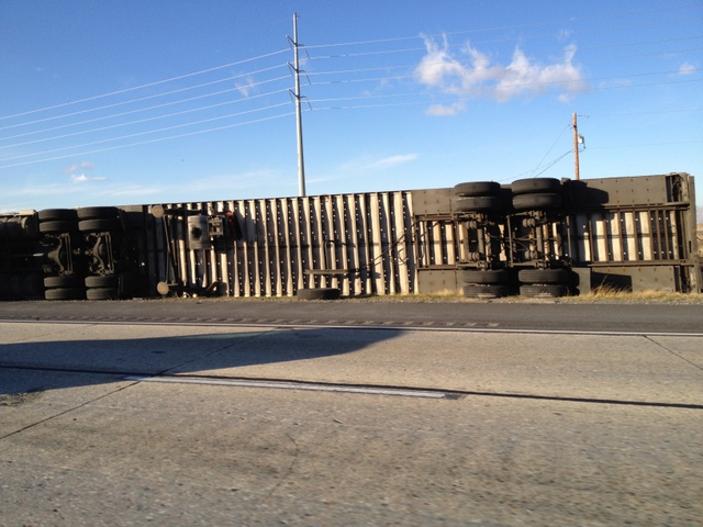 A trailer blown over on I-15 in Davis County.