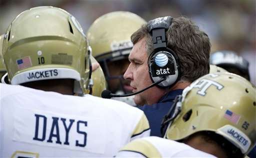 Georgia Tech coach Paul Johnson talks to his
team during a timeout. (AP Photo/Rich Addicks)