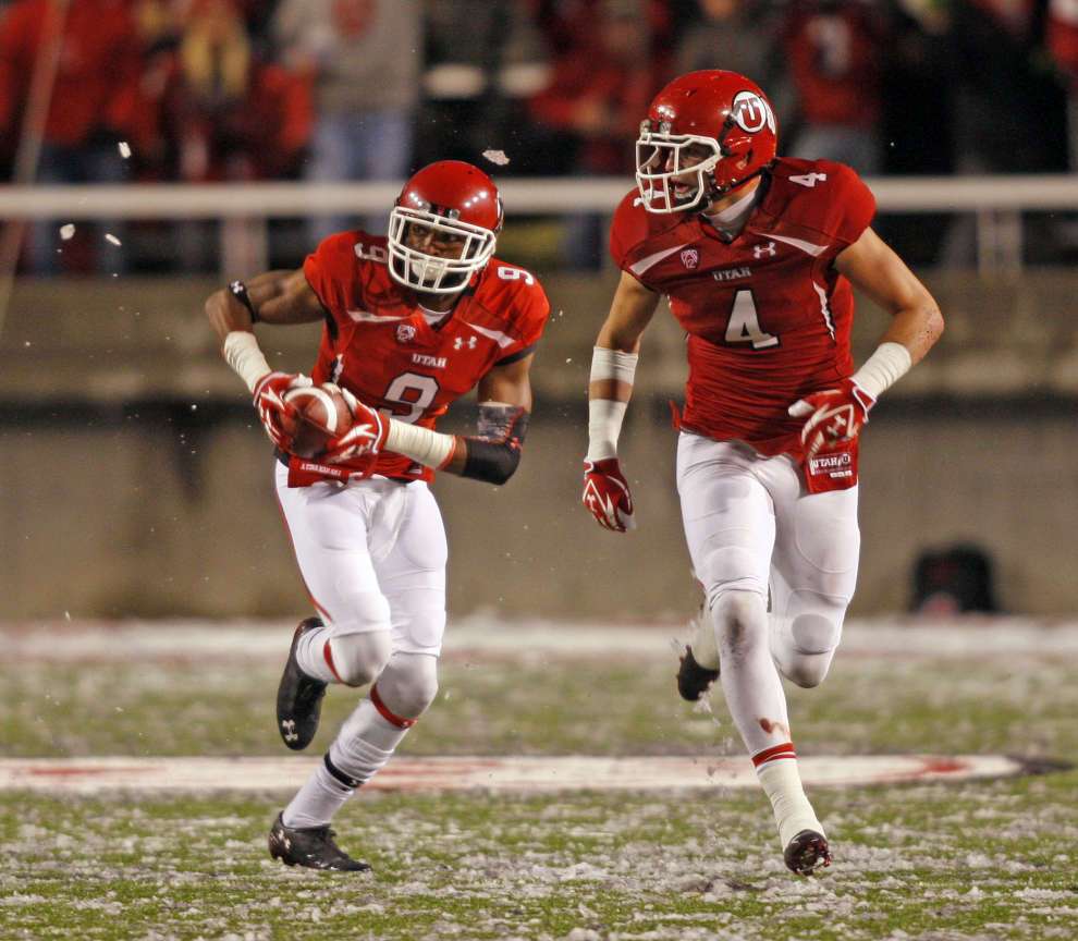 Utah Utes defensive back Conroy Black (9) returns an interception for a touchdown as the University of Utah defeats UCLA 31-6 in PAC 12 football Saturday, Nov. 12, 2011 in Salt Lake City, Utah. (Tom Smart, Deseret News)