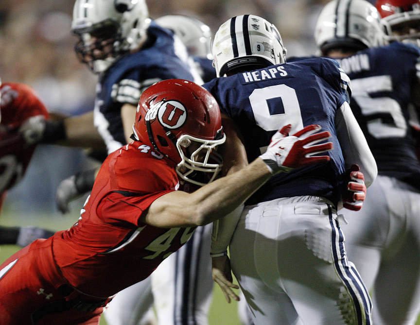 Utah Utes linebacker Trevor Reilly (49) sacks Brigham Young Cougars quarterback Jake Heaps (9)as BYU and Utah play Saturday, Sept. 17, 2011. (Scott G Winerton, Deseret News)
