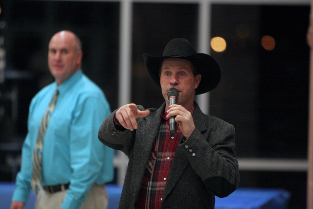 Auctioneer Shane Frost, right, works the crowd during a benefit dinner and auction Monday, Dec. 5, 2011, in Roosevelt. The event was held to help raise funds for Kaden McCormick, a 22-month-old Roosevelt boy who needs a kidney transplant. It brought in more than $31,000.