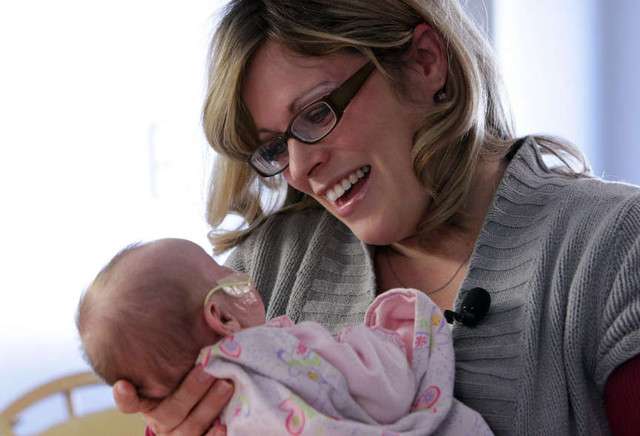 Paula McKay holds her 6 week old baby Ashlyn at Primary Children's Medical Center in Salt Lake City Wednesday, Dec. 7, 2011. Ashlyn has cancer and is being treated with chemotherapy.