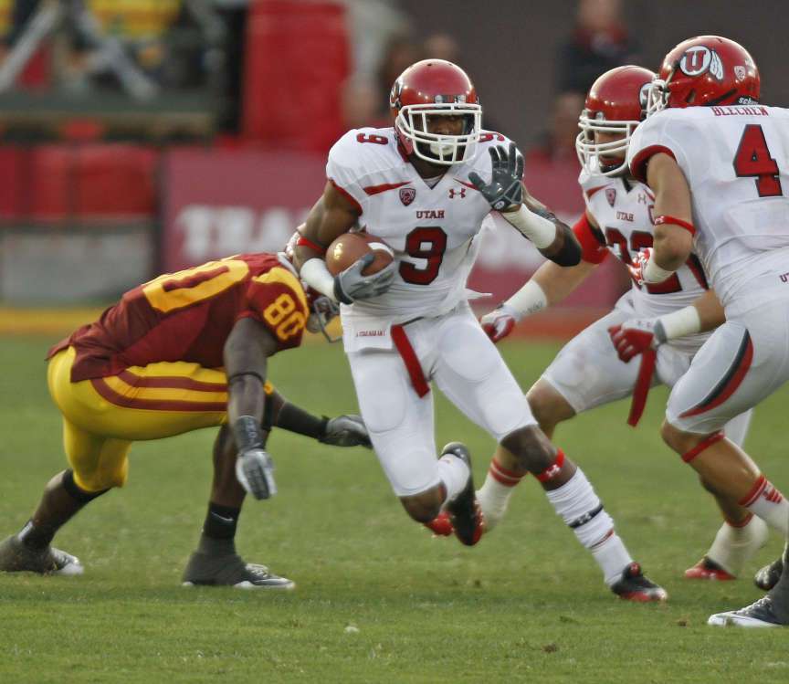 Utah Utes defensive back Conroy Black (9) runs the ball against USC at the Los Angeles Memorial Coliseum in the first ever Pac-12 game Saturday, Sept. 10, 2011. (Tom Smart, Deseret News)