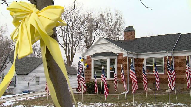 Family and friends worked to decorate the yard 
for Seth Pack's homecoming. They put up 25 
flags in the lawn.