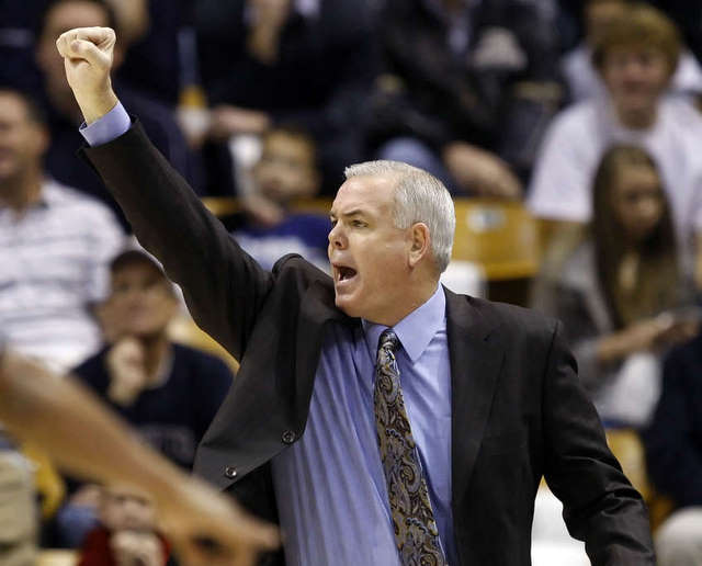 BYU head coach Dave Rose celebrates after a
win.