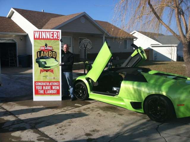 David Dopp poses in front of his home with his new Lamborghini Murcielago.(Photo courtesy Annette Dopp)