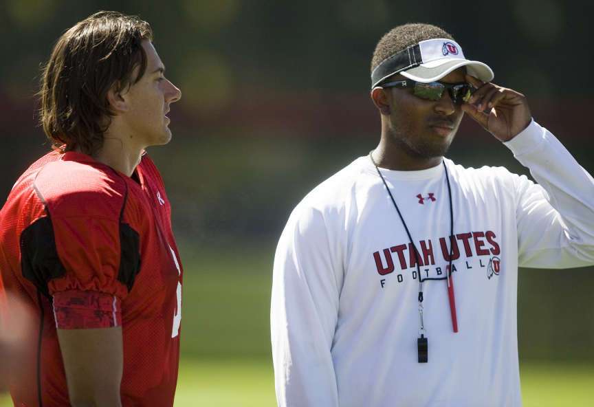 Former Utah quarterback Brian Johnson with quarterback Jordan Wynn during practice at the U of U baseball field in Salt Lake City on Tuesday, Aug. 9, 2011. (Mike Terry, Deseret News)