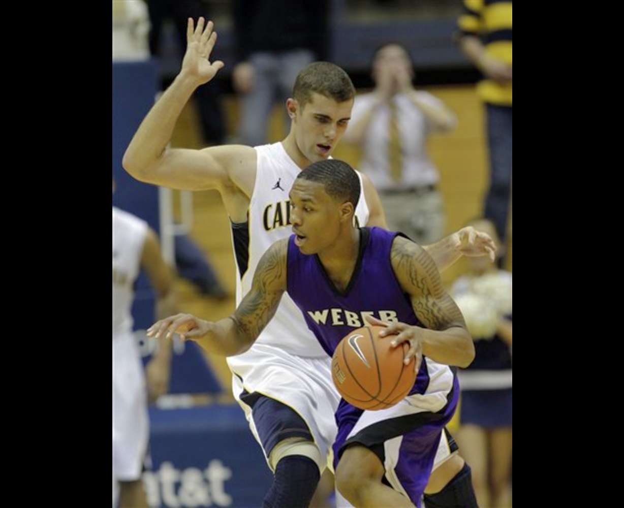 Weber State guard Damian Lillard (1) tries to
get around California 's Harper Kamp.
California won 77-57. (AP Photo/Marcio Jose
Sanchez)