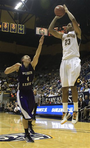 California guard Allen Crabbe (23) scores over 
Weber State 's Scott Bamforth. 
California won 77-57. (AP Photo/Marcio Jose 
Sanchez)