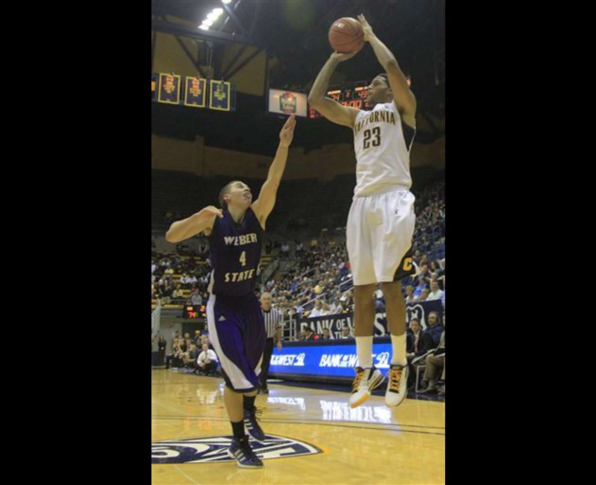 California guard Allen Crabbe (23) scores over
Weber State 's Scott Bamforth.
California won 77-57. (AP Photo/Marcio Jose
Sanchez)