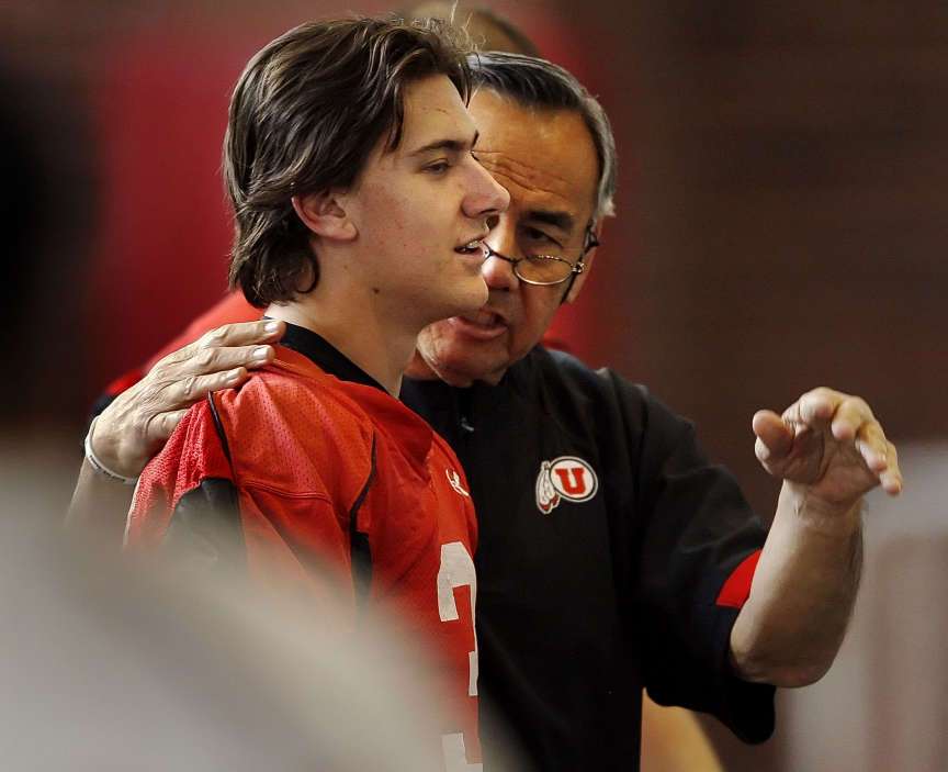 Norm Chow the University of Utah's new Offensive Coordinator gives some instruction to Quarterback Jordan Wynn during the first practice of spring Tuesday, March 8, 2011 in the indoor practice facility. (Scott G Winterton, Deseret News)