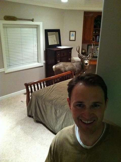 Casey Keller stands near where a buck was trapped in his home Christmas eve in a surprising visit.