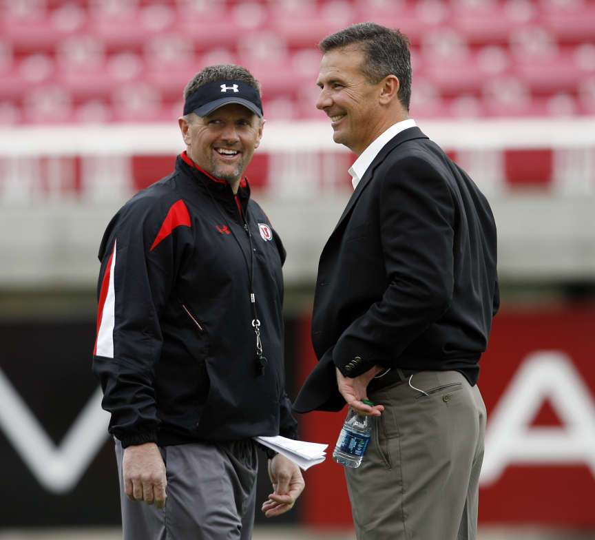 Former Utah football coach Urban Meyer, at right, talks with Utah football coach Kyle Whittingham during University of Utah football practice at Rice Eccles Stadium in Salt Lake City, Utah, Thursday, March 17, 2011. (Ravell Call, Deseret News)