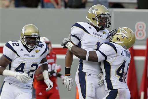 Georgia Tech's Isaiah Johnson (1) celebrates his touchdown following an interception against North Carolina State (AP Photo/Gerry Broome)