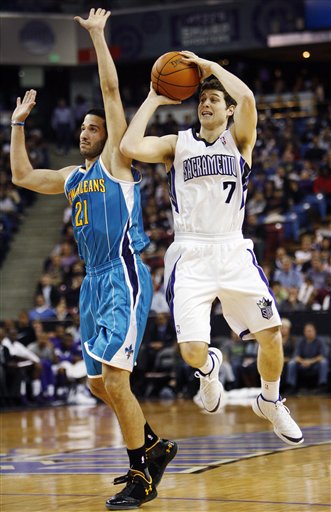 Sacramento Kings guard Jimmer Fredette (7)
shoots against New Orleans Hornets' Greivis
Ayon (21). (AP Photo/Steve Yeater)