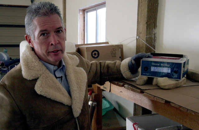 Scott Hill, program manager for the Uintah Basin Winter Ozone Study, talks about the air quality readings displayed on a ozone monitor located at Split Mountain Garden Center in Jensen, Uintah County, on Tuesday, Jan. 3, 2012. (Photo: Geoff Liesik, Deseret News)