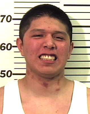 Man facing murder charges surrenders to police